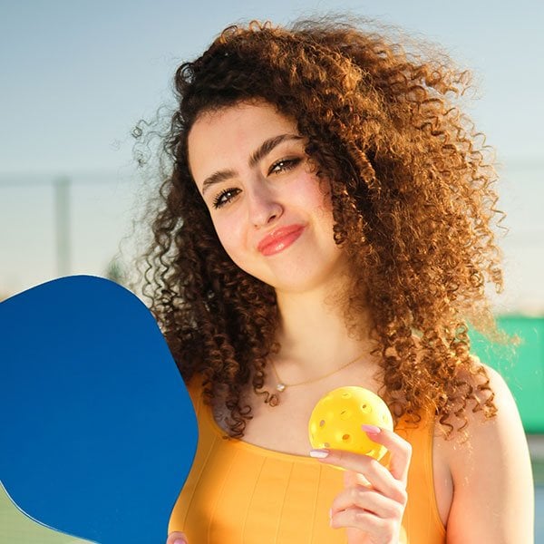 portait of a young happy and smiling curly