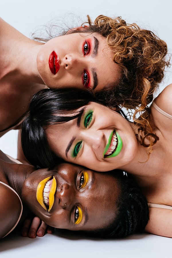 three girls from different ethnicities posing in s